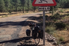 0949 bike and sign road down hill